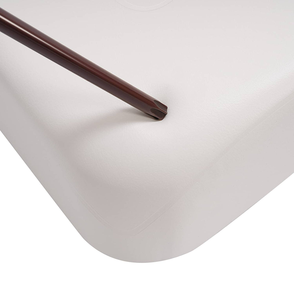 White seat back cushion corner with smooth edge and sewn seam