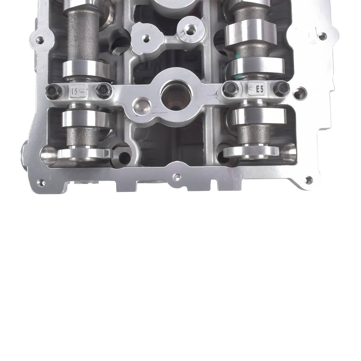 Cylinder head close-up with valve spring areas and camshaft journals, bare metal.