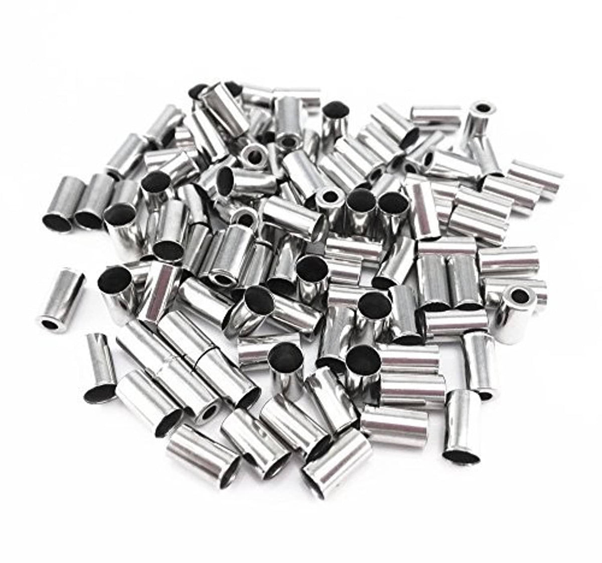 Bike brake cable ferrules, pile of shiny silver metal end caps with open center