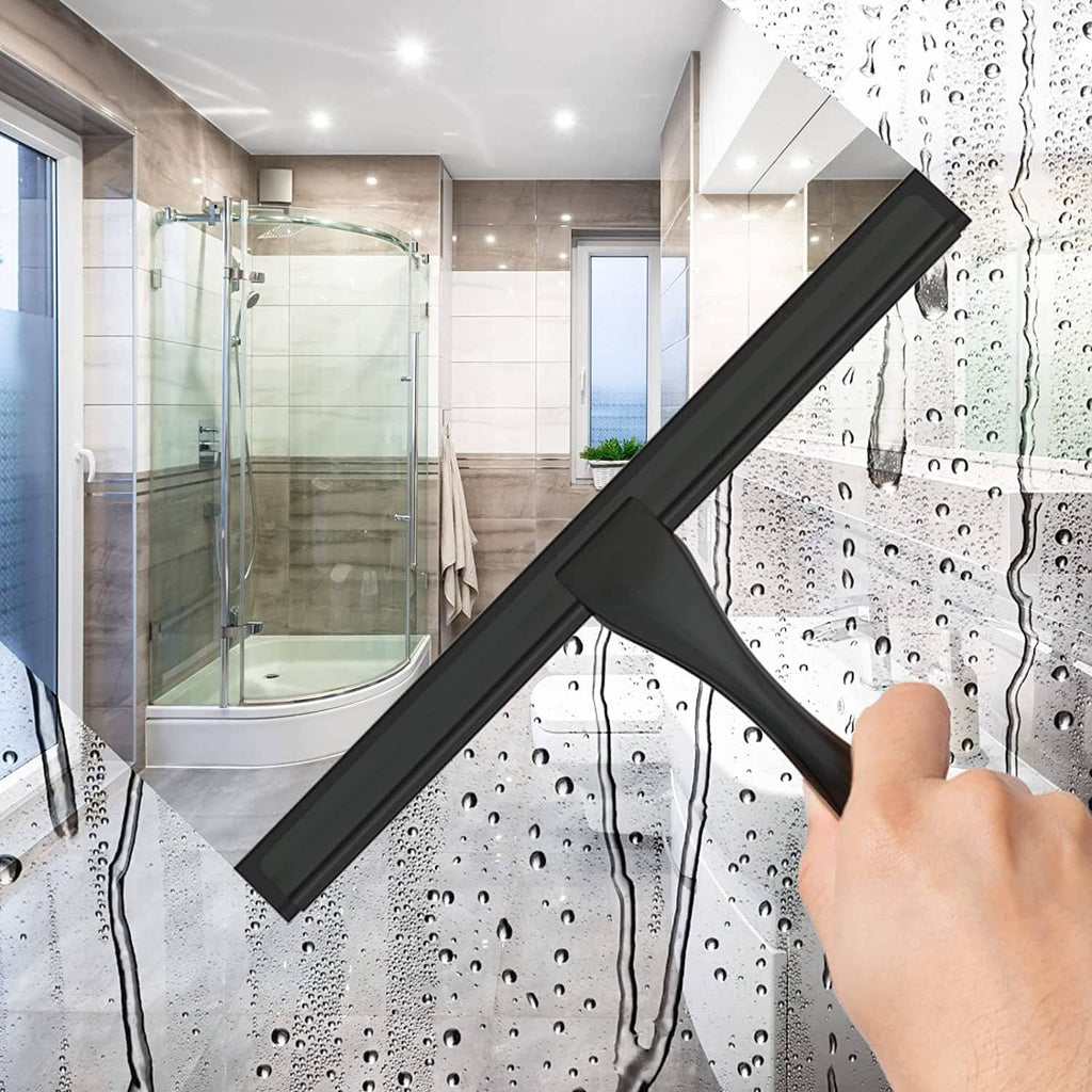 Black shower glass squeegee held at an angle to remove water from glass.