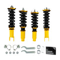 Coilover suspension kit with black springs and yellow shock bodies, plus mounting hardware