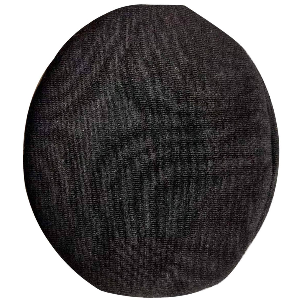 Round black fabric headphone earpad cover, textured cloth surface