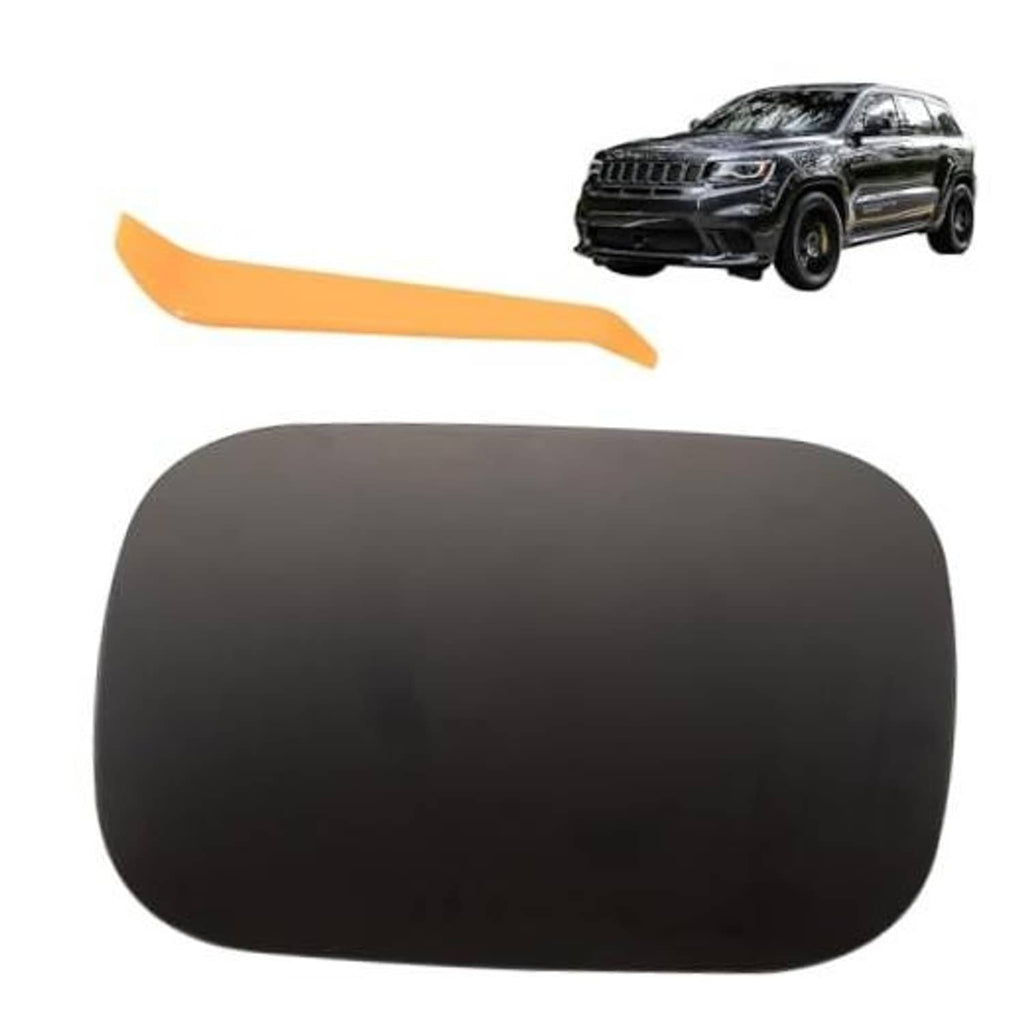 Black fuel tank filler door cover with gas cap opening, smooth rounded shape