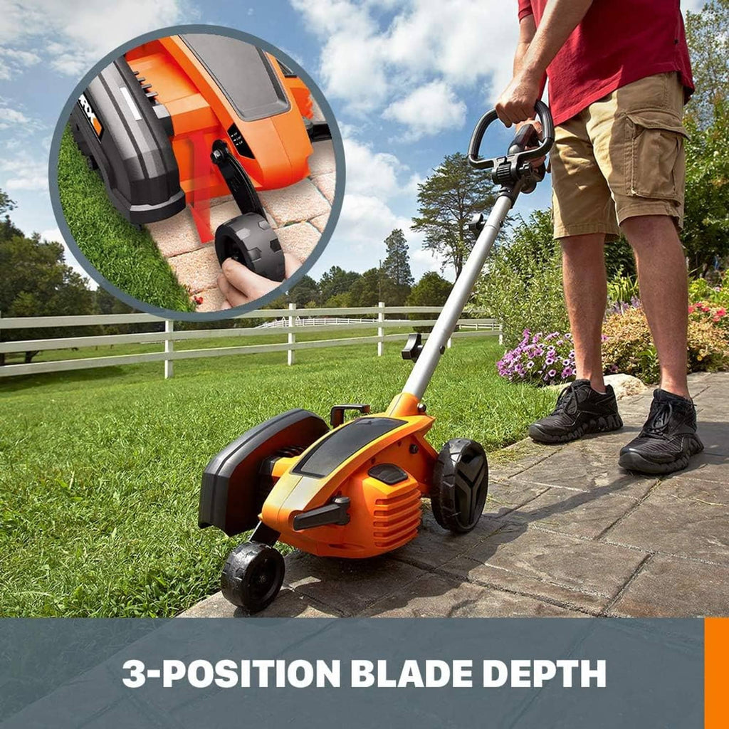 Orange corded lawn edger/trencher with wheels for edging along a walkway