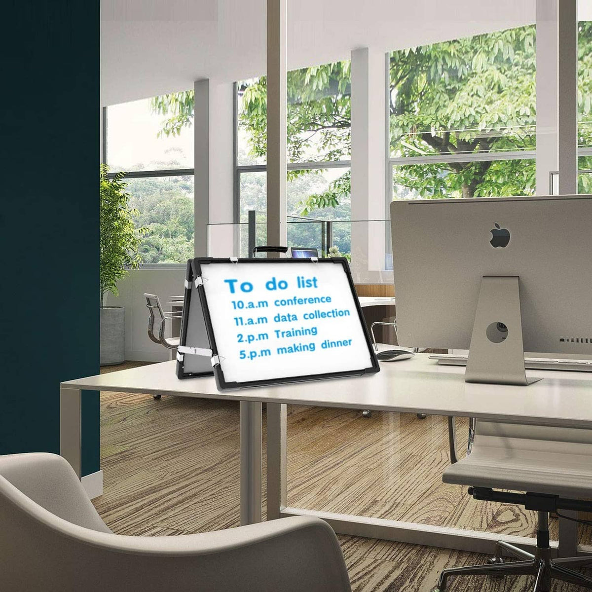 Angled tabletop dry erase whiteboard with black frame and white writing surface