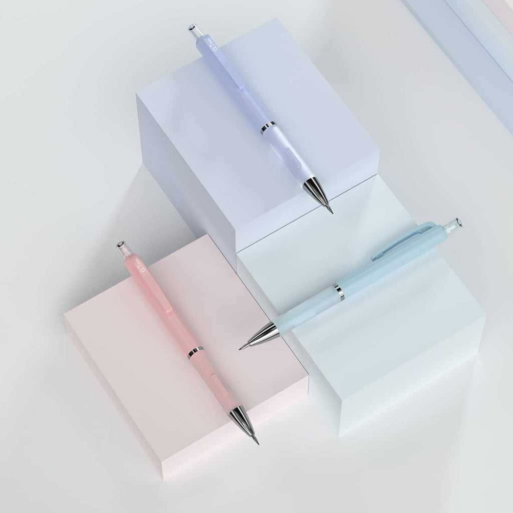Three mechanical pencils in pastel blue and pink arranged on white stepped blocks