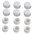 Twelve white PVC pipe end cap plugs with female threads, round tops