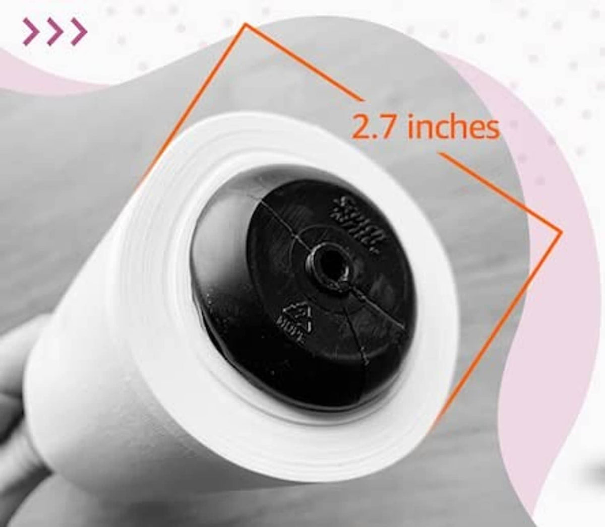 Close-up of a lint roller refill roll inside a white-lined storage case