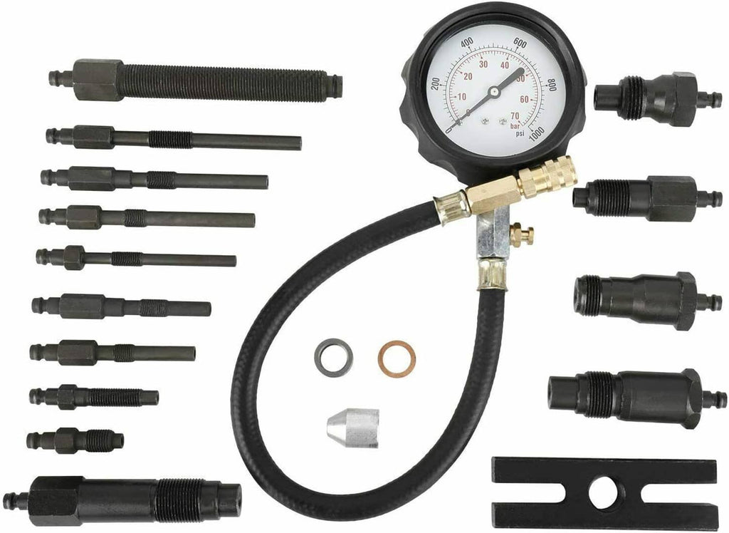 Engine compression tester with round pressure gauge, black hose, brass fittings, and adapters