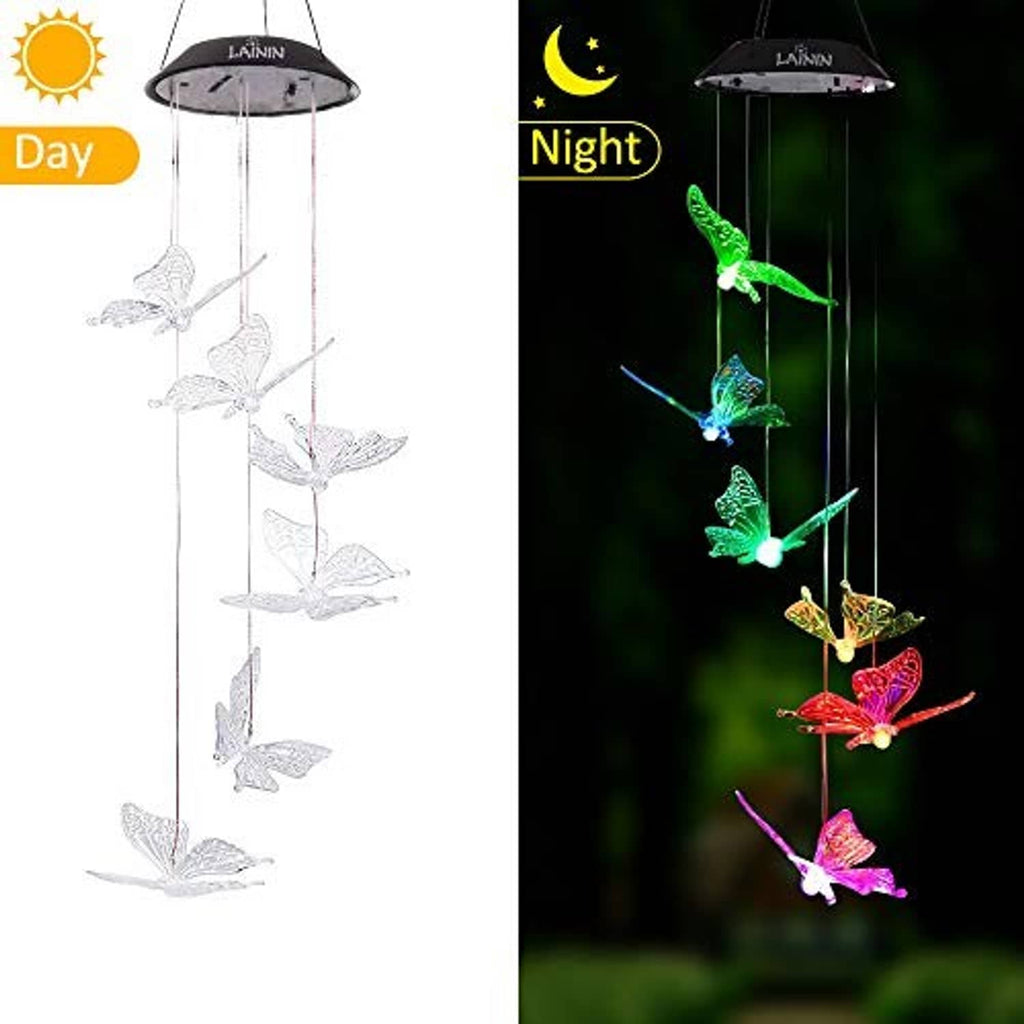 Solar butterfly wind chime showing day and night glow from a black lantern top