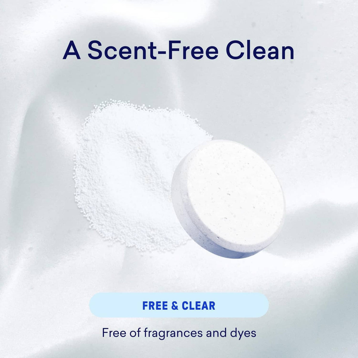 White powder and round detergent tablet on a smooth surface
