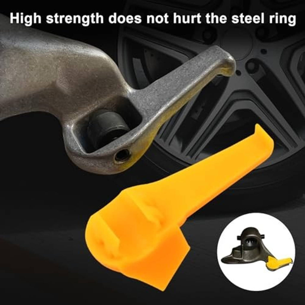 Yellow plastic insert head cover for tire changer tool, protecting a steel rim edge