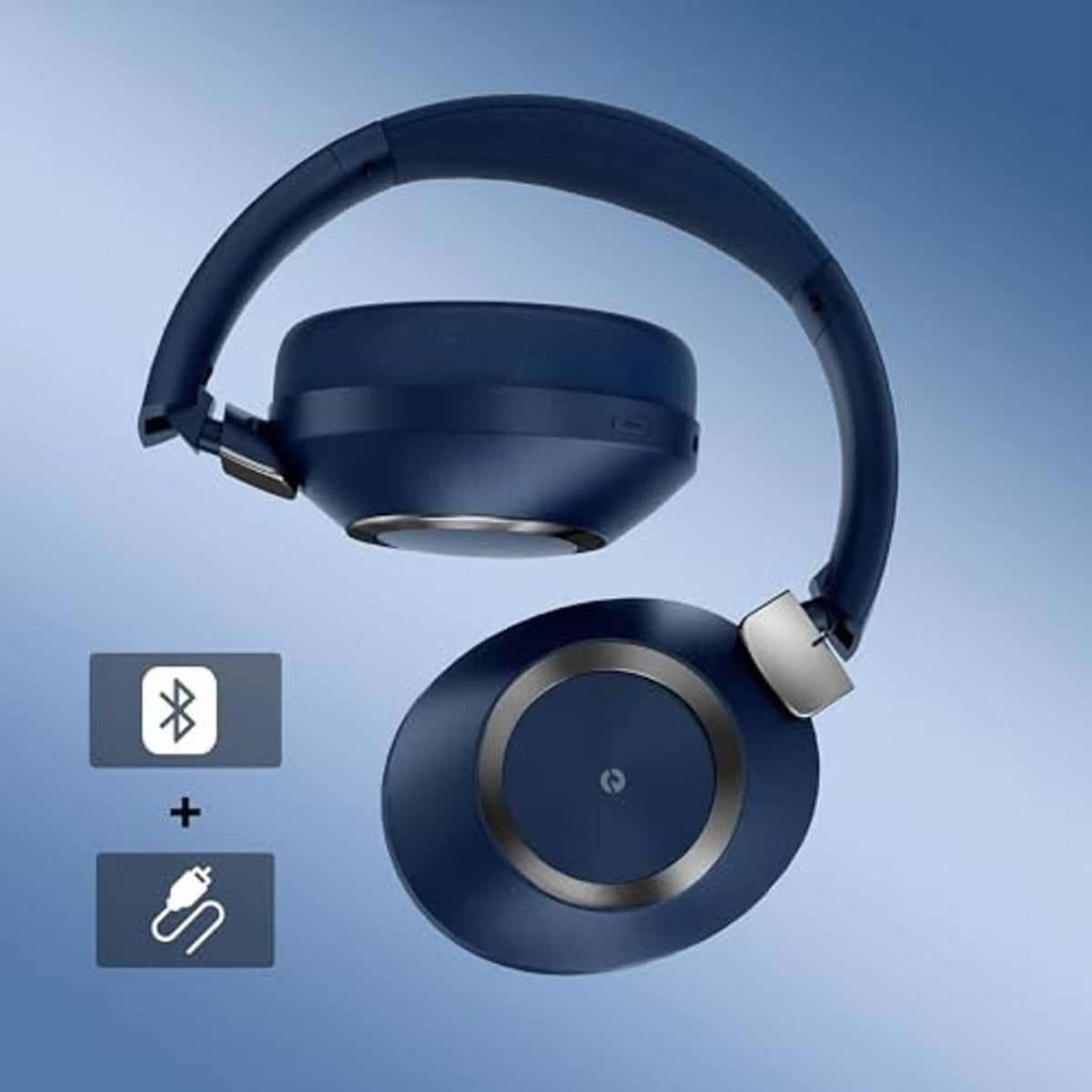 Blue over-ear headphones with circular power button and cushioned ear cups