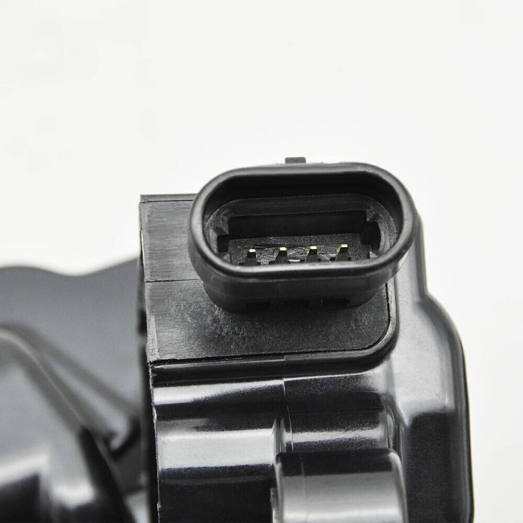 Close-up of ignition coil connector and terminals with black housing and metal body