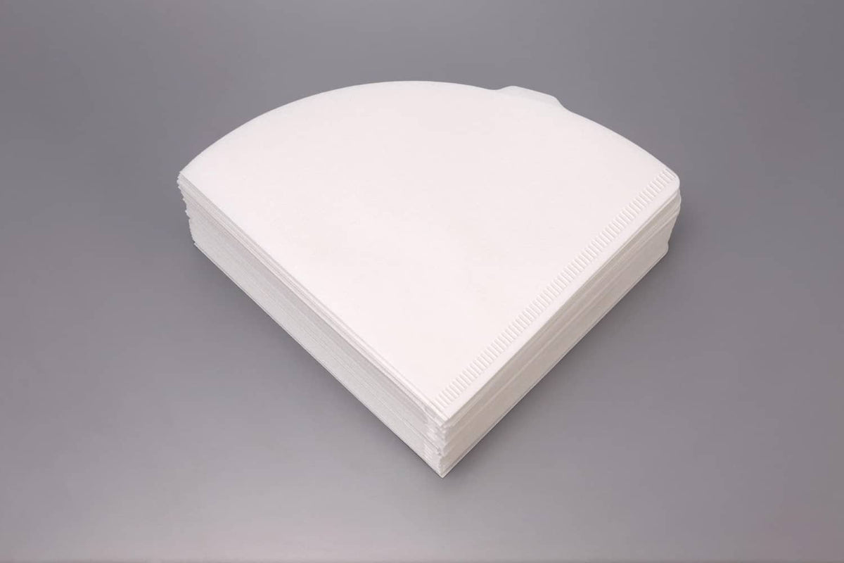 Stack of white paper coffee filters, Size 02