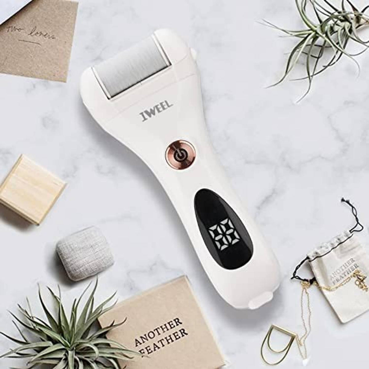 White electric foot callus remover with silver roller head and round power button