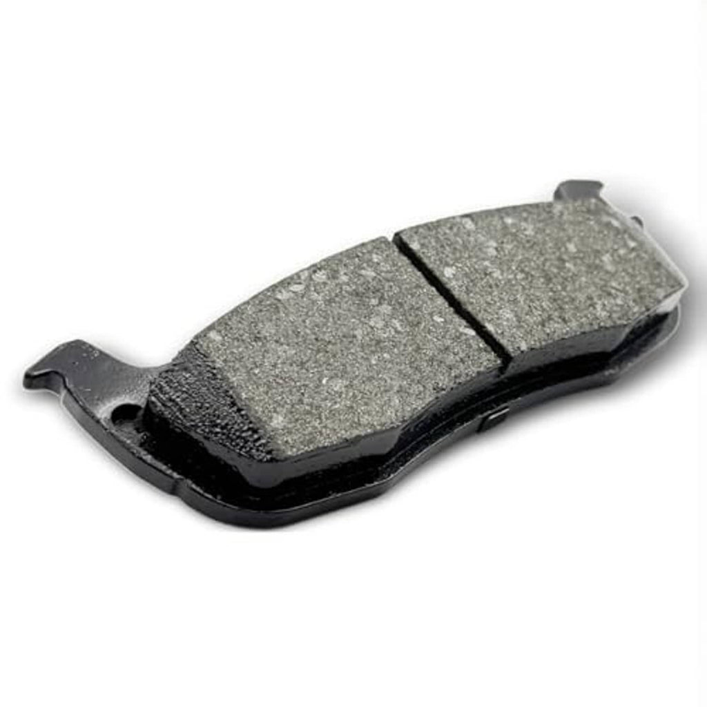 Ceramic brake pad with grey friction surface, black edges, and side wear indicators.