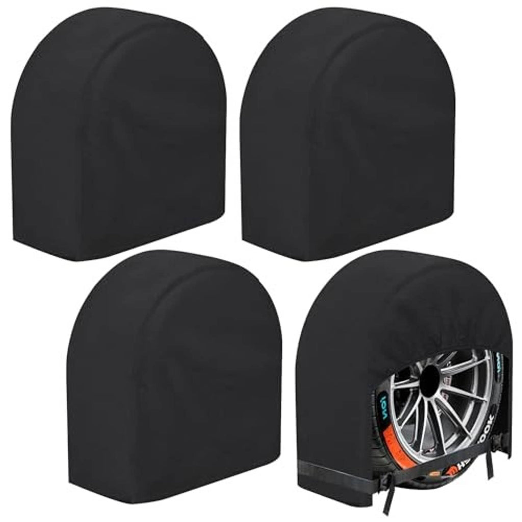 Black RV tire cover set of four arched caps; one cover fitted over a wheel