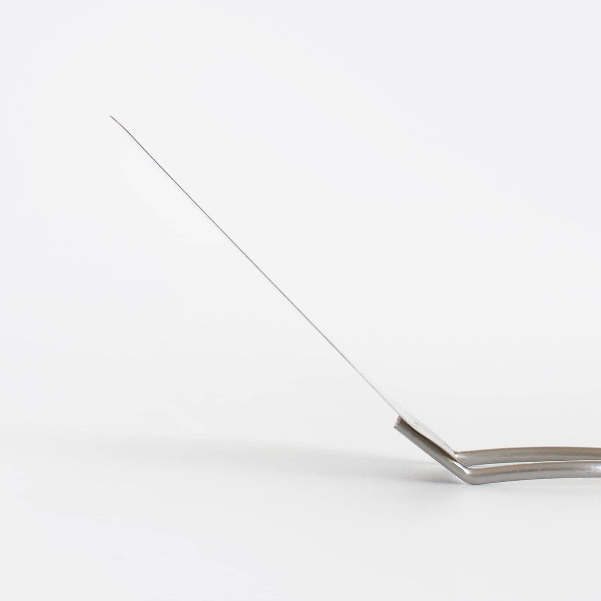 Thin stainless steel turner blade tip of a cookie spatula