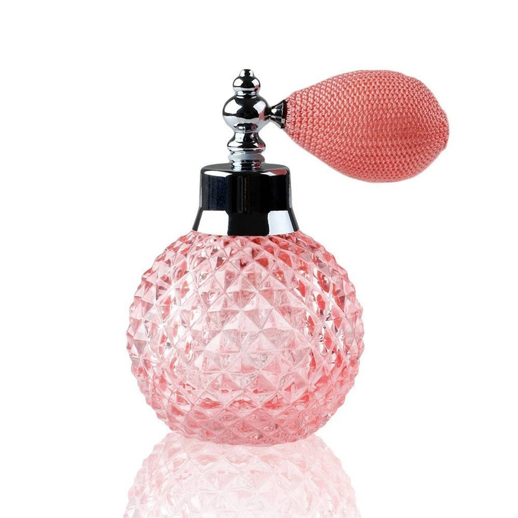 Refillable crystal perfume atomizer with pink faceted bottle and silver spray nozzle cap