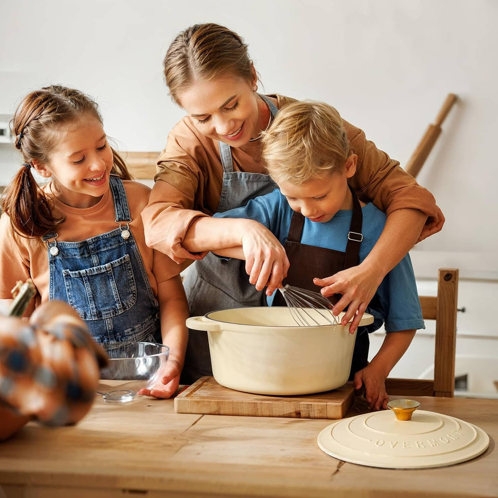 Cream enameled Dutch oven on a table with lid on during cooking