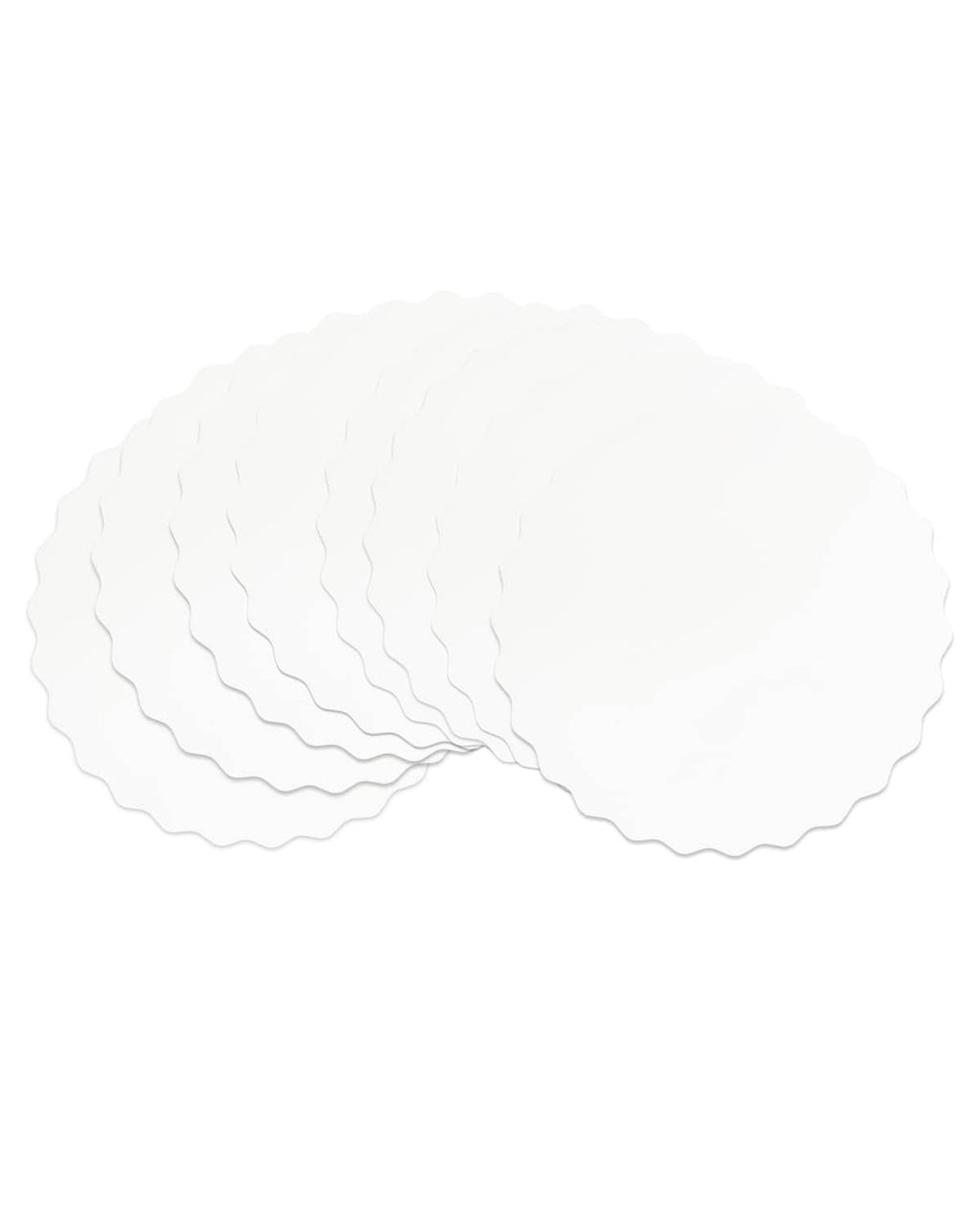 Fan-style stack of white round wave cake boards with scalloped edges