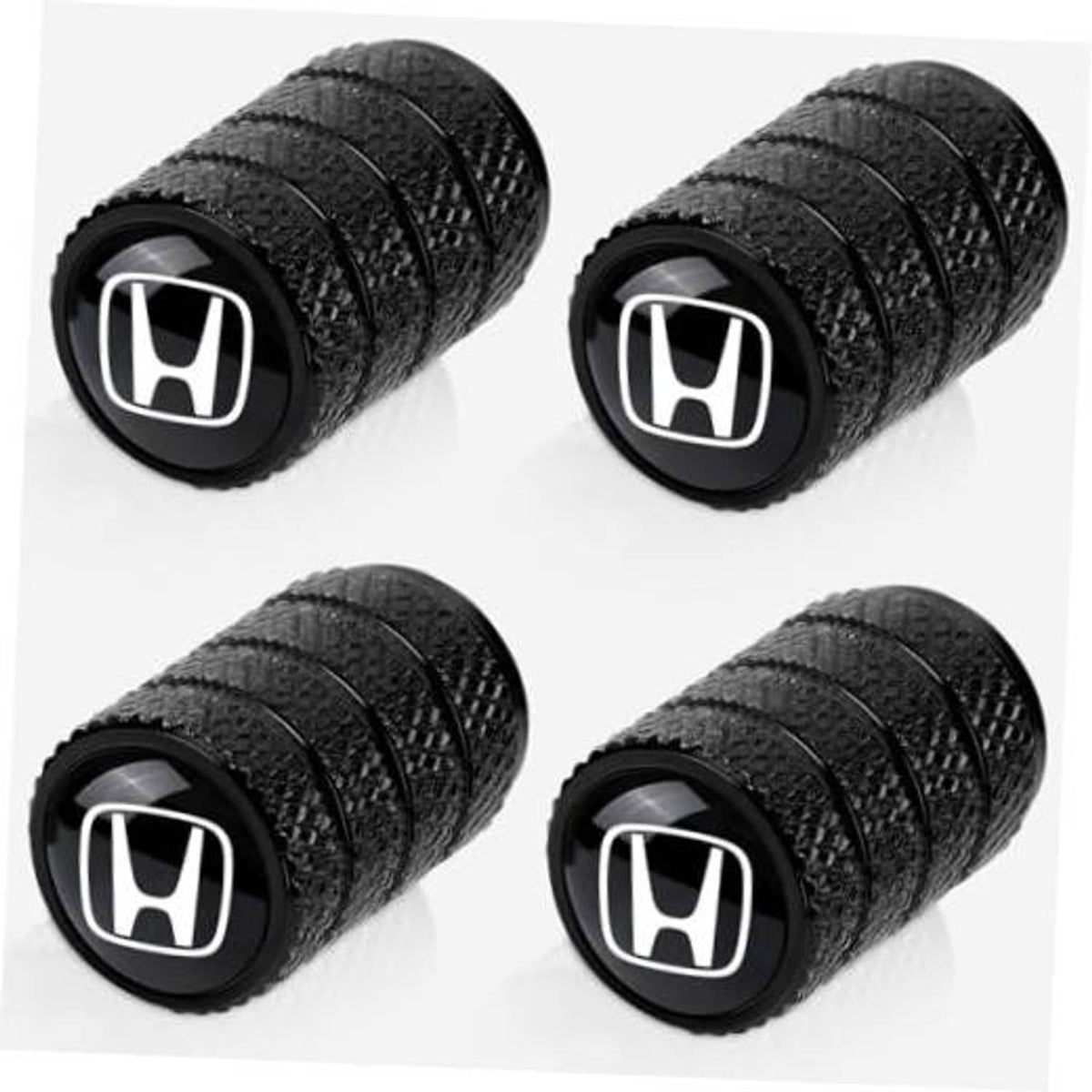 Set of 4 black tire valve stem caps with white Honda logo, textured grip