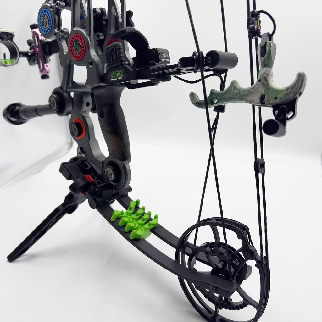 Compound bow with green camo trigger release attached, shown with lanyard cord