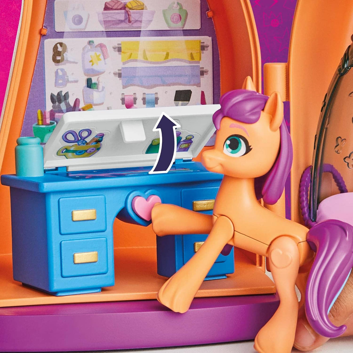 Orange unicorn doll posed at blue vanity kitchen area inside the playset