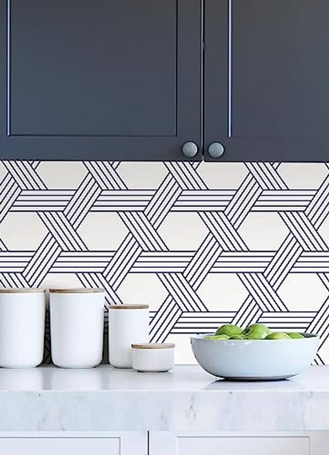 Blue-and-white geometric lattice wallpaper on kitchen wall.