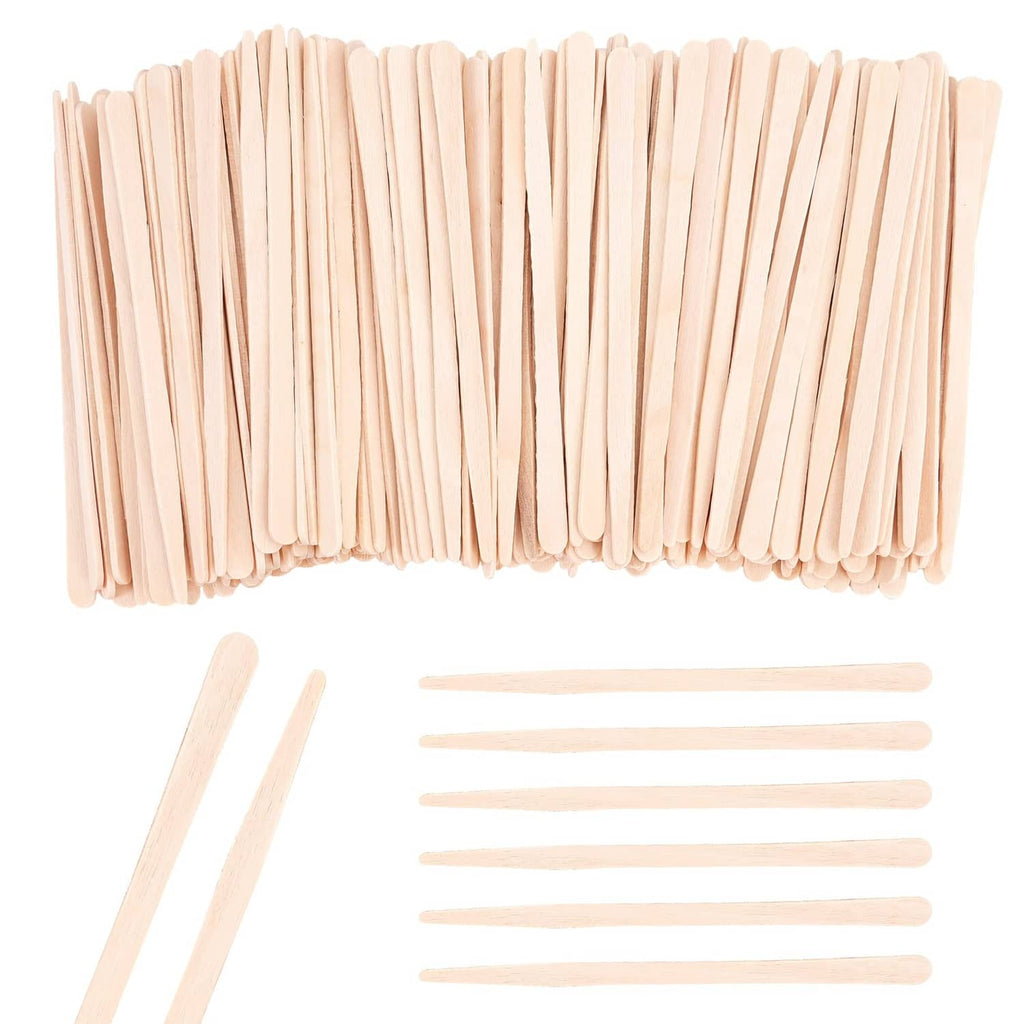 Eyebrow wax stick applicators and flat wooden spatula tools, light natural wood