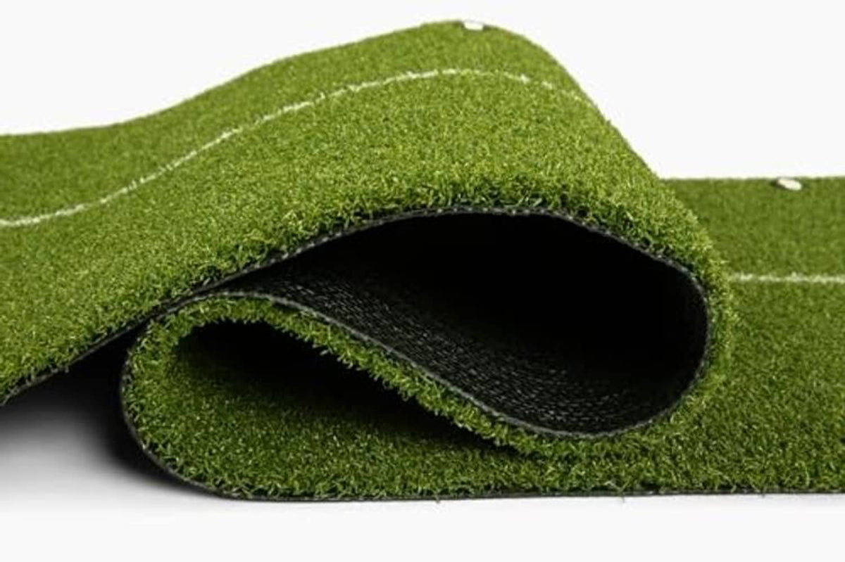 Rolled edge view showing black underside backing on the green mat
