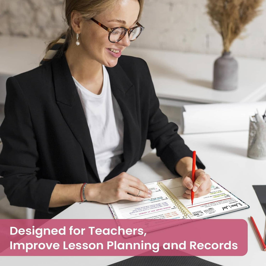 Teacher writing in an academic planner during lesson planning