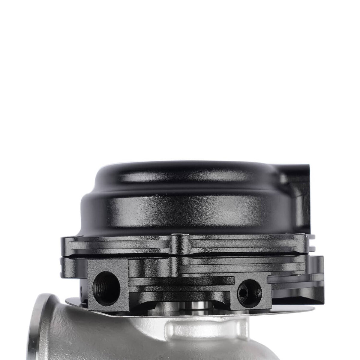 External turbo wastegate close-up of black top cap and silver actuator body