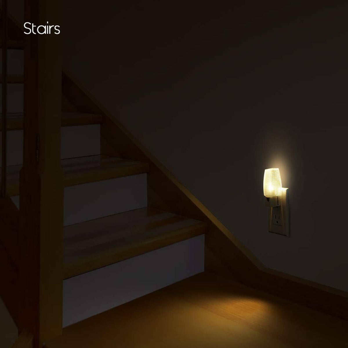 Plug-in LED night light wall outlet nightlight showing warm white illumination