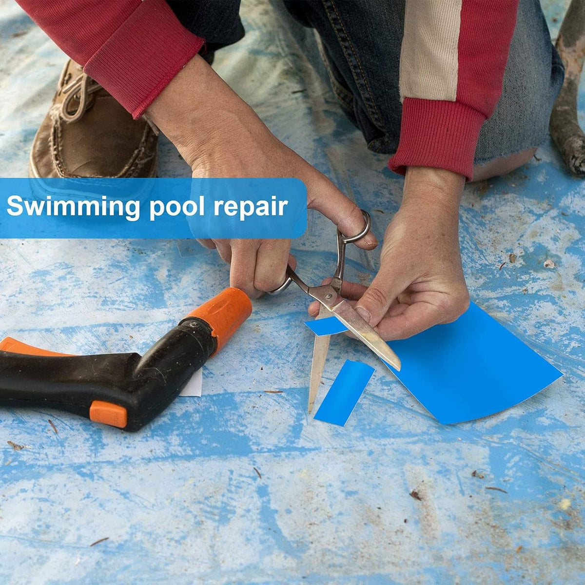 Blue self-adhesive vinyl patch on a swimming pool liner during repair