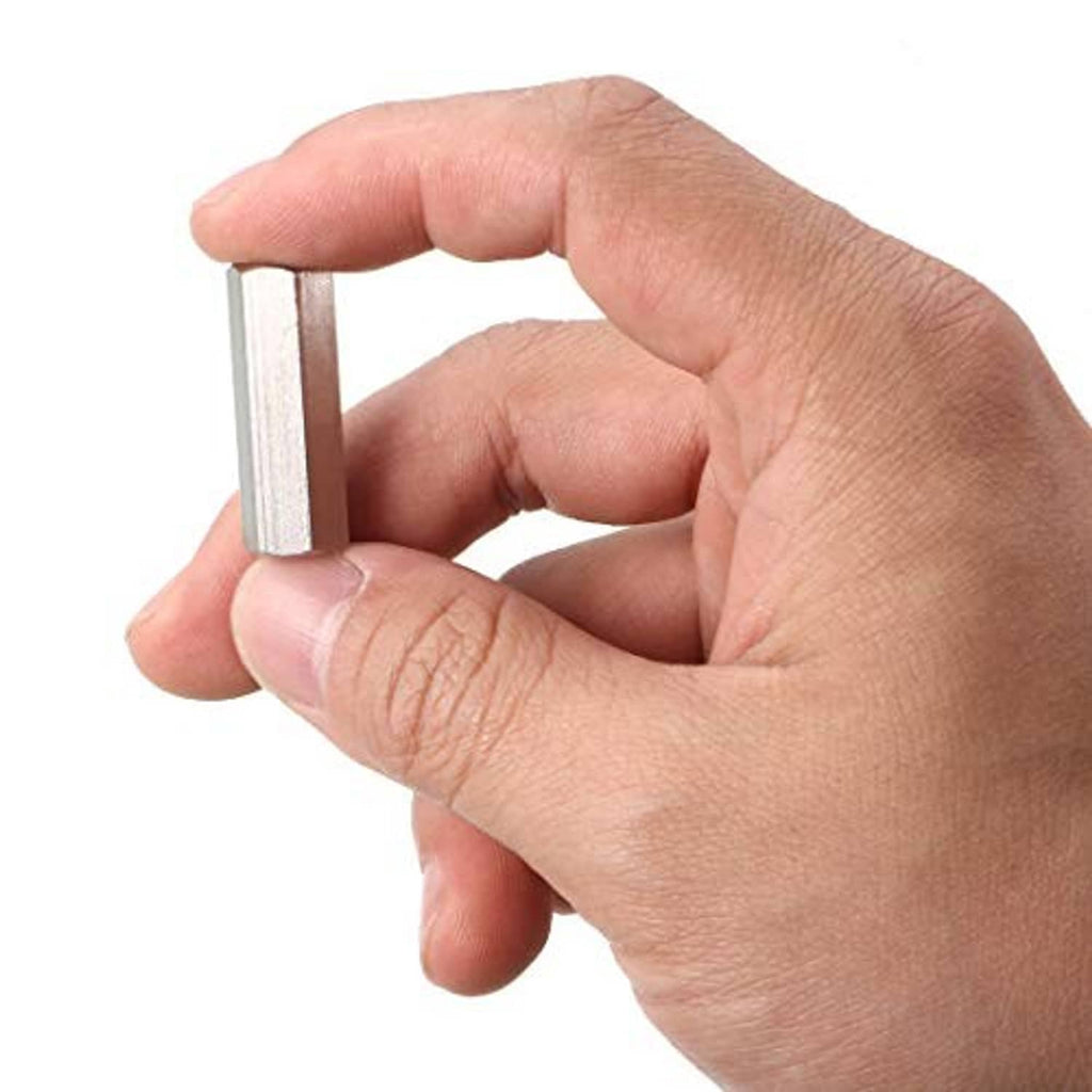 Hand holding stainless steel M6 hex coupling spacer, 30mm long with internal thread
