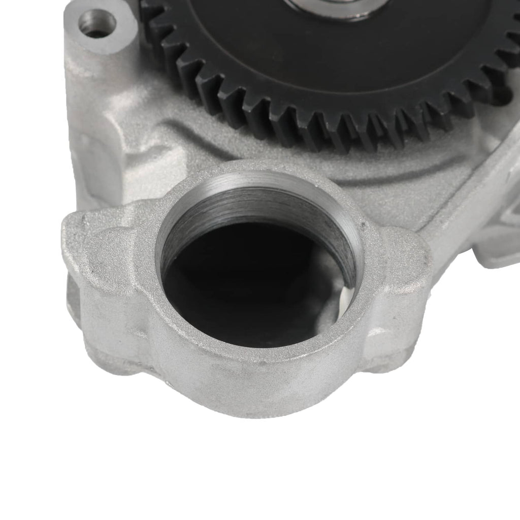 Oil pump housing close-up showing large intake bore and gear teeth edge