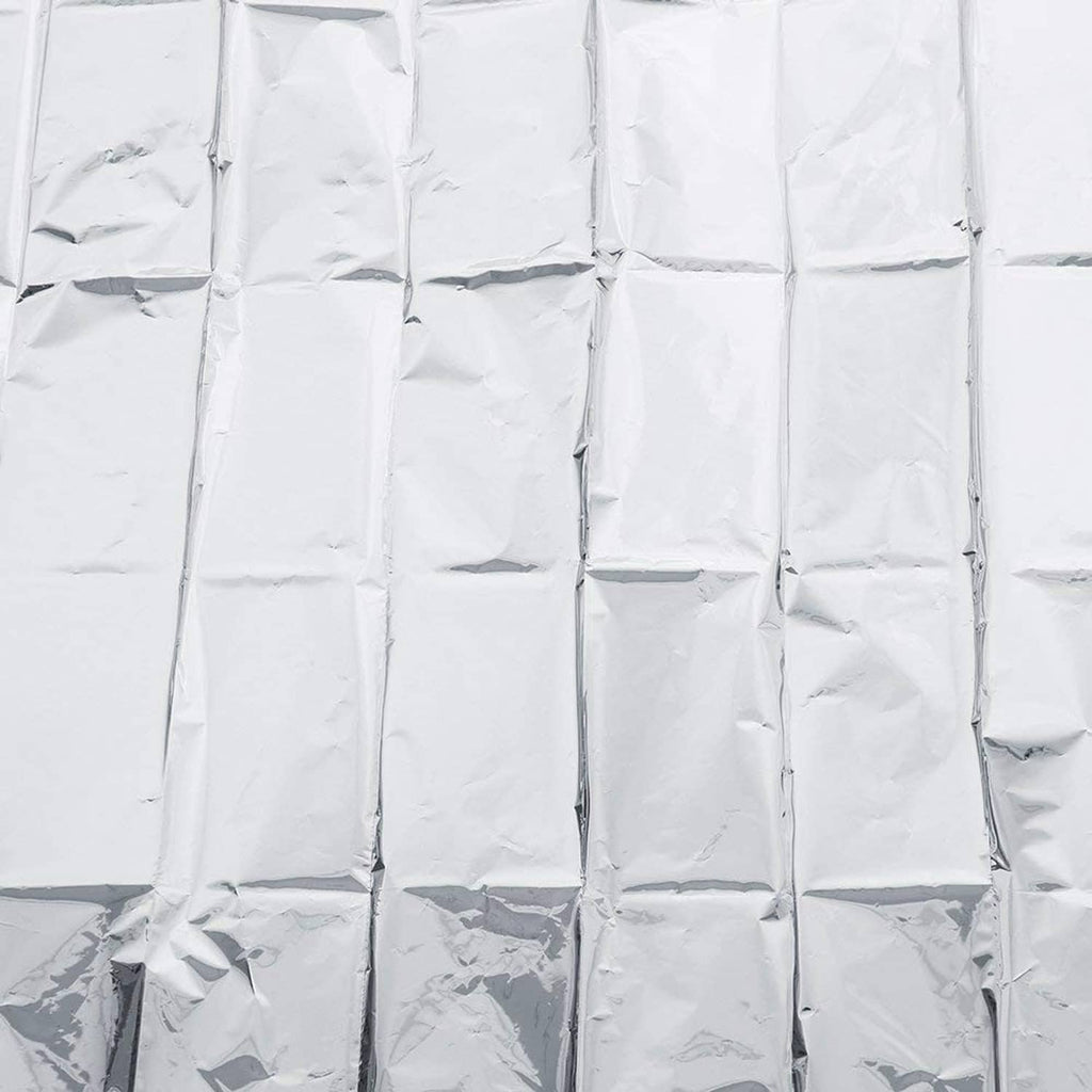 Silver reflective mylar film close-up, textured crinkle foil panels