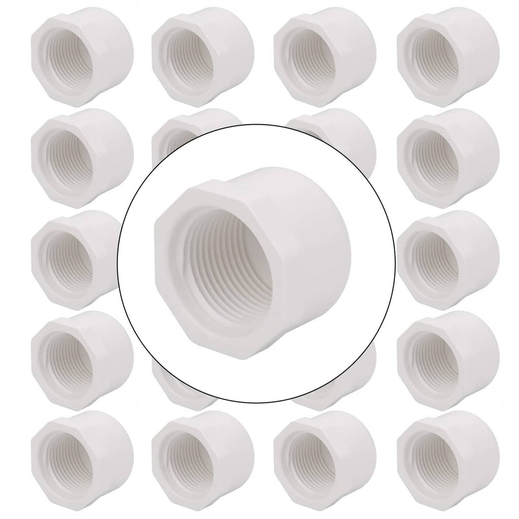 White 3/4 inch PVC female pipe end caps, shown in a group