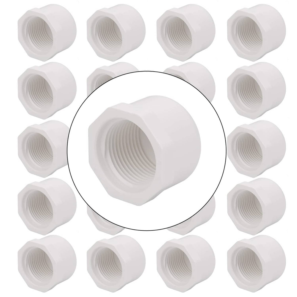 White 3/4 inch PVC female pipe end caps, shown in a group