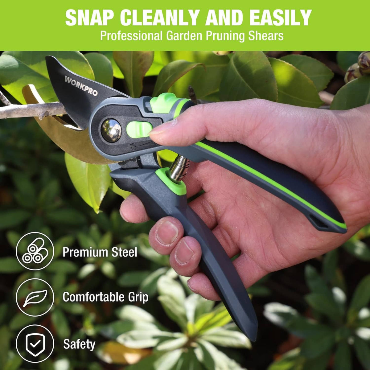 Bypass pruning shears held in hand, black handle with green accents and tan blade