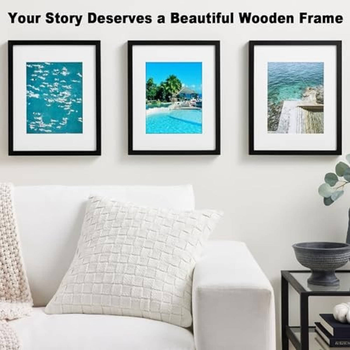 Black wooden picture frame with white mat and clear glass, showing ocean photo