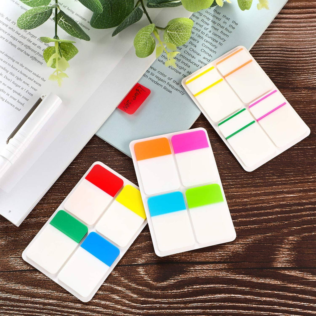 Colorful sticky index tabs with white writable sections, stacked on a desk
