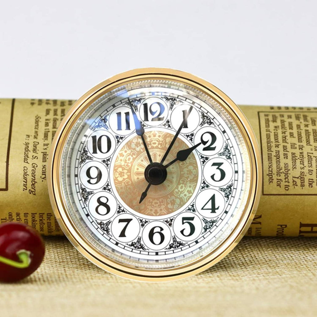 Round mini quartz clock insert with gold rim, white dial, black numerals, and hands