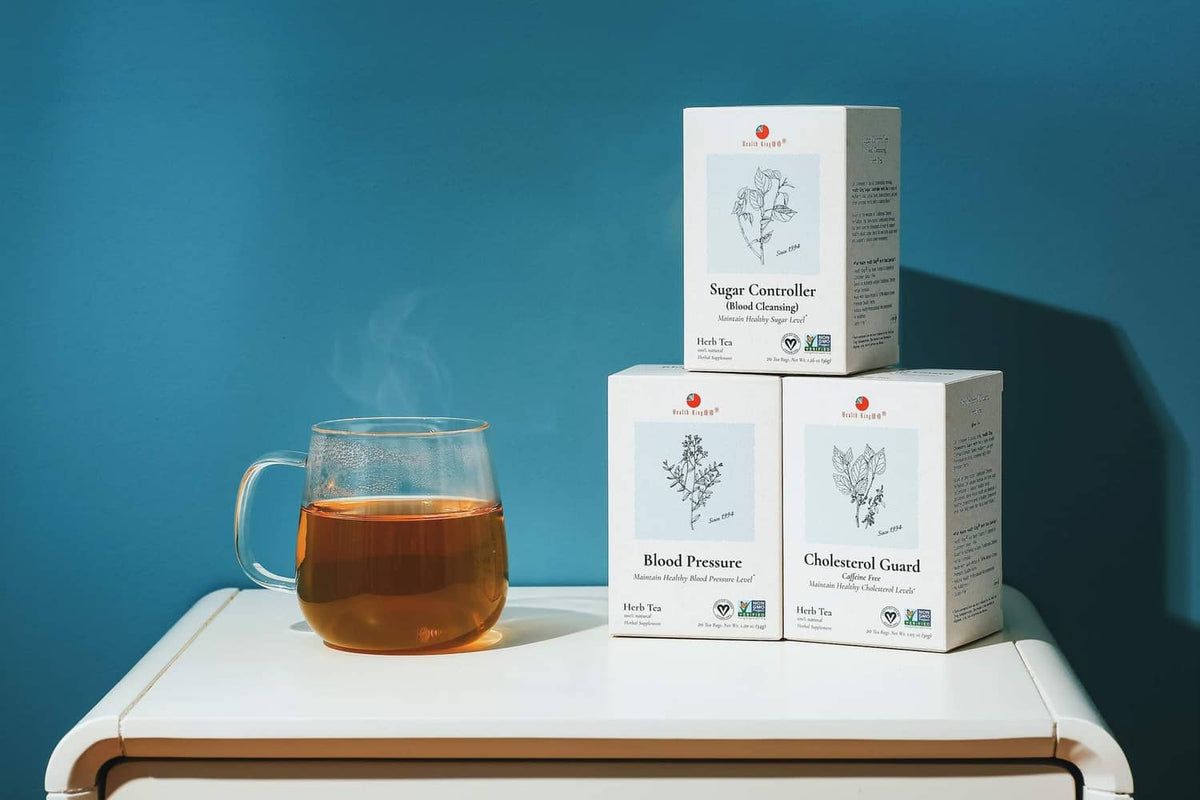 Blood Pressure herb tea boxes with glass mug of tea on tray.