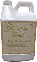 White laundry detergent jug with gold 'Glamorous Wash' label and 'High Maintenance'.