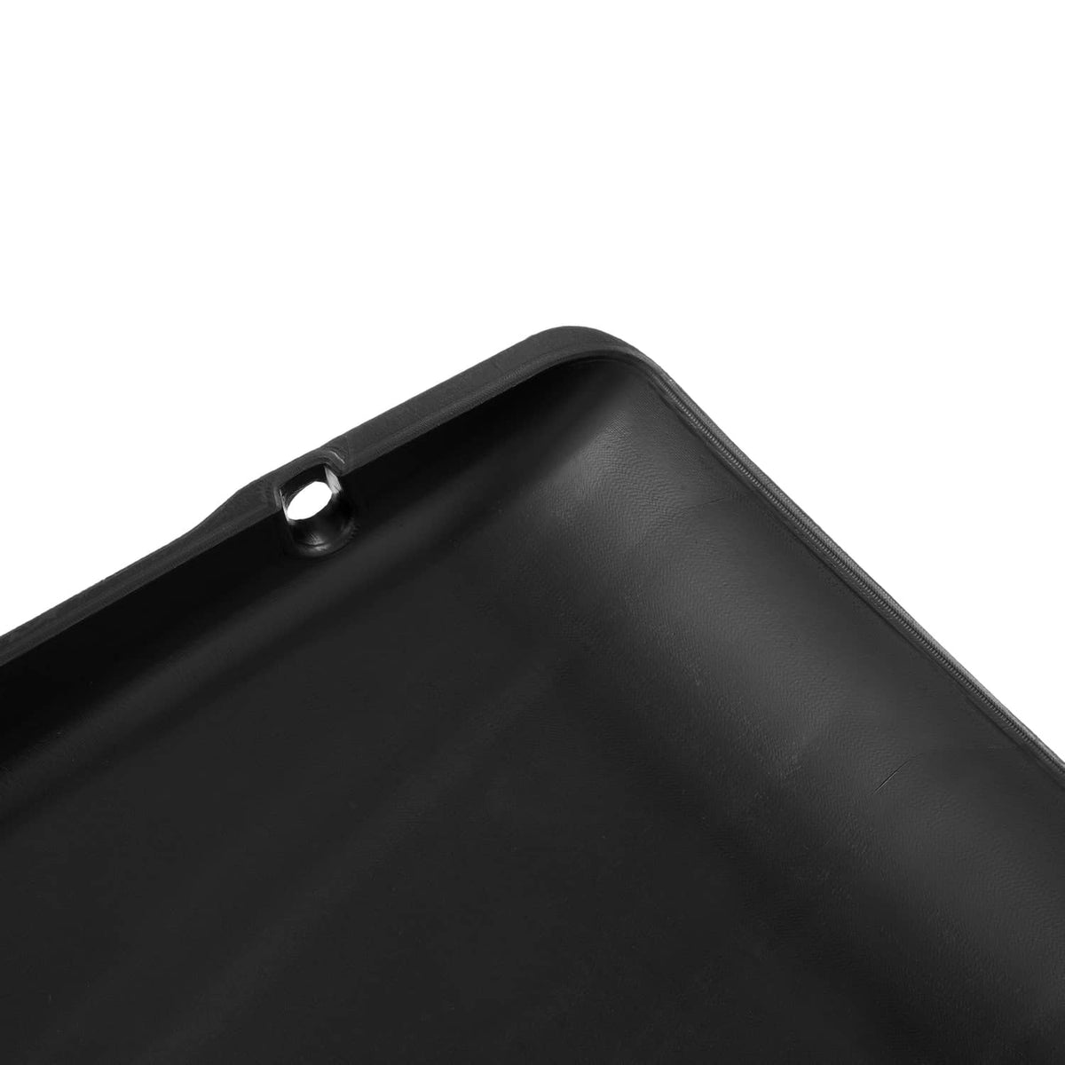 Close-up of black scuff guard corner with recessed mounting hole