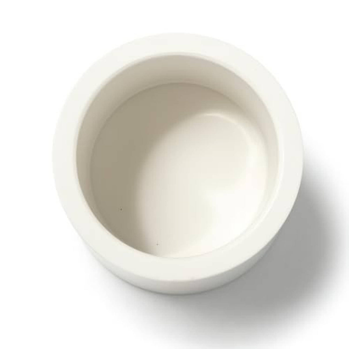 White PVC pipe end cap with visible inner round socket opening