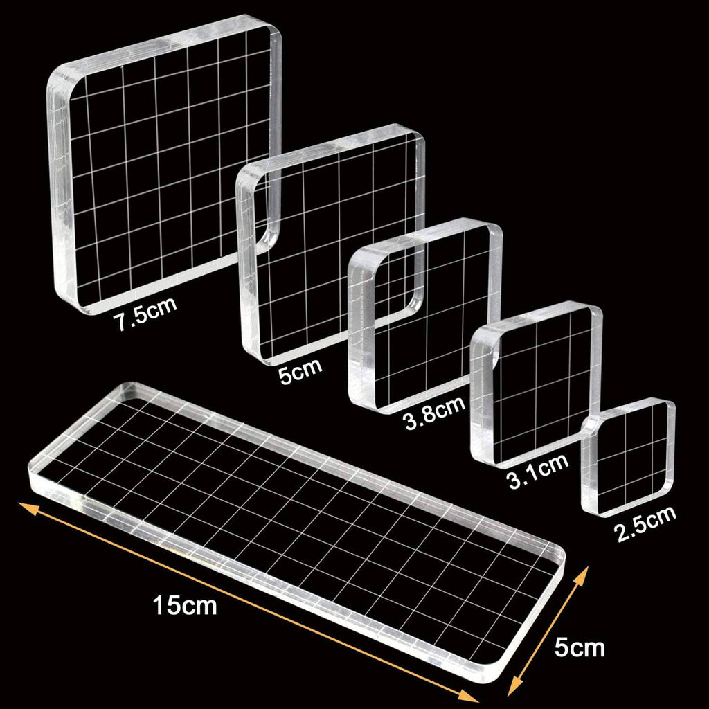 Clear acrylic stamp blocks with grid lines and size markings, multiple rectangles